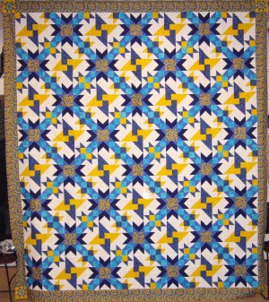 A
quilt in a variety of star patterns.